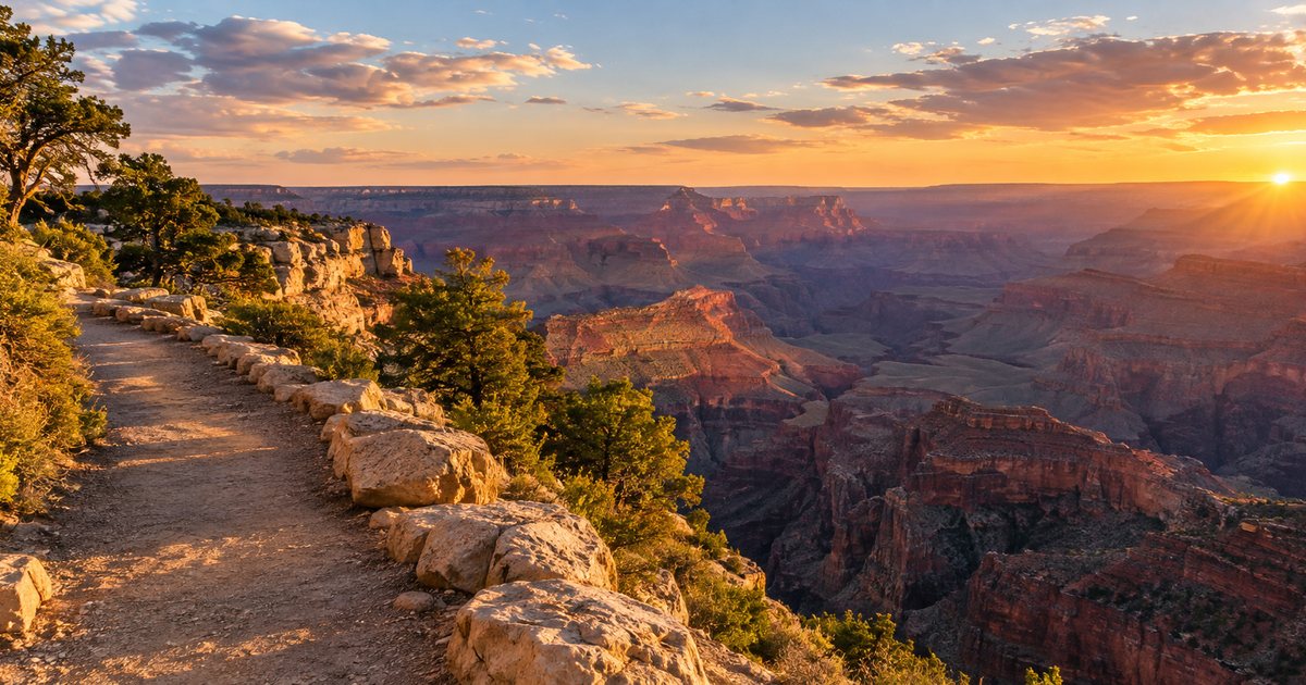 Illustration of a dirt path edged with pale stones running along a canyon rim in late-afternoon light, with layered red canyon walls below and a low sun on the horizon.